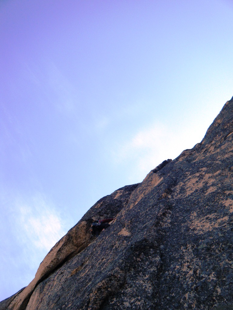 Tony above the crux bulge on the same pitch. This part of the pitch features really fun positive moves up an arching crack followed by a couple of rock humping mantles.