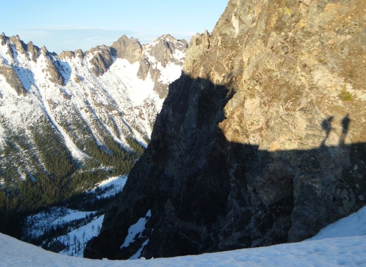 Our shadow just before skiing lovely corn down spire gully and a nice sunset.